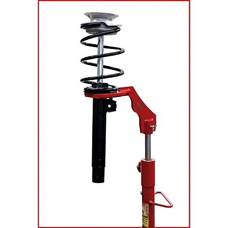 Ein Stoßdämpfer mit Feder und rotem Werkzeug.